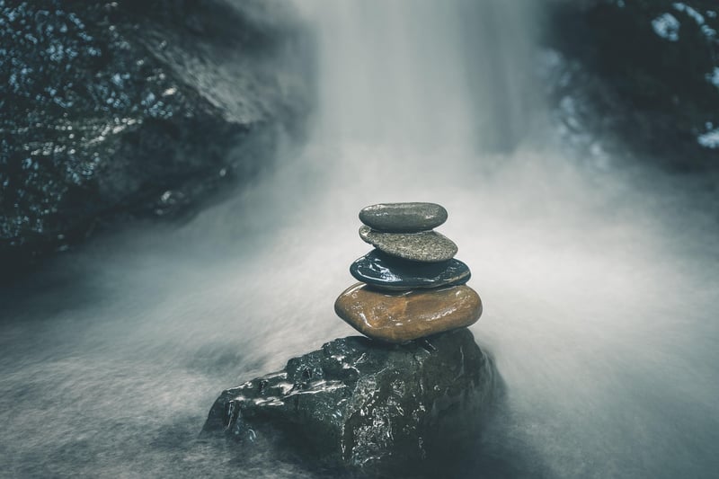Balanced stones by the water